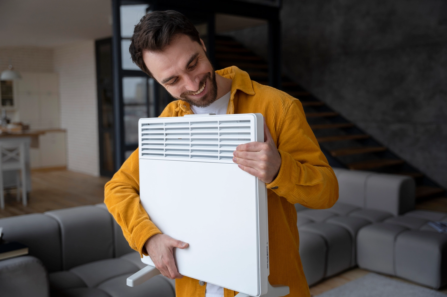 a person holding a hepa air purifier